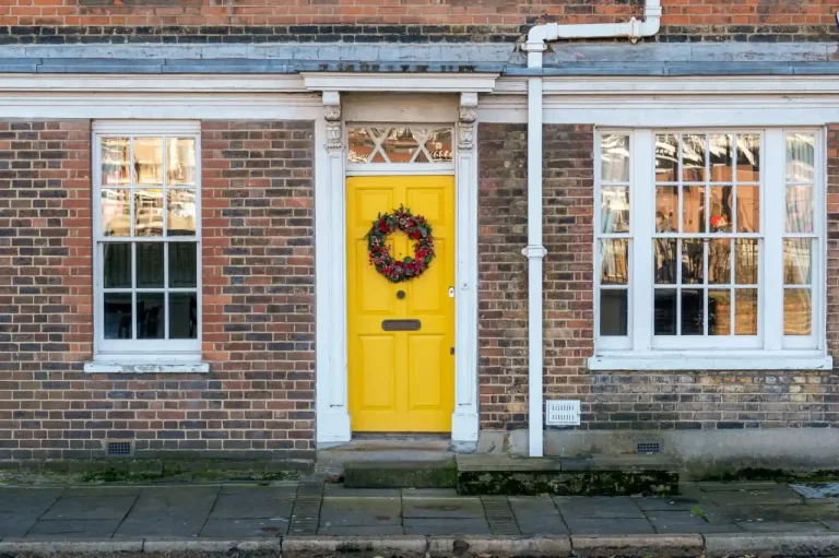 Types of door locks in the UK – yellow front door on a red-brick Victorian house in Birmingham, Locksmith Birmingham guide to identifying your lock