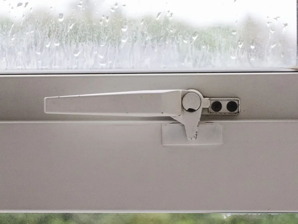 Locking handle on a white window frame – locksmith Sutton Coldfield door and window lock checks from Locksmith Birmingham